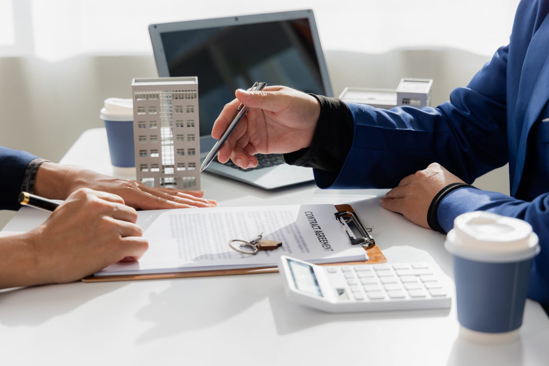 professionals reviewing contract building